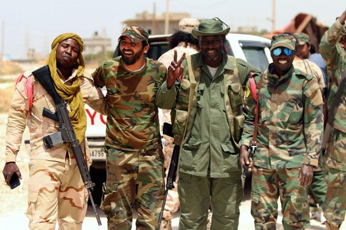Pro-goverment-forces-patrolling-area-near-Benghazi-fighting-militants_AFP